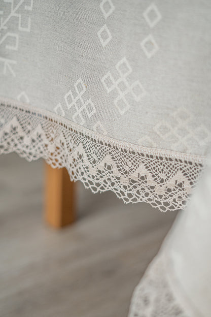 Linen and cotton natural tablecloth with Austra tree pattern and Latvian Power symbols